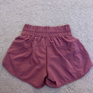 Size four, four inch raspberry lululemon shorts. Barely worn